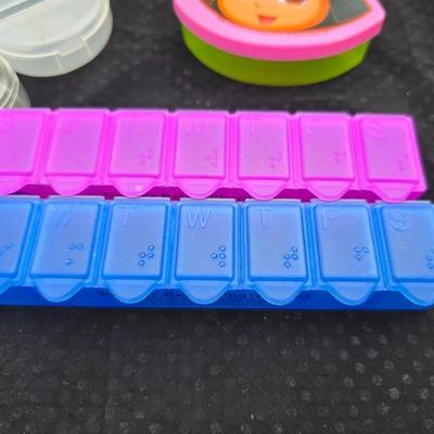 Grouping of bath soaps - scented - pill organizers - and a new shower curtain liner