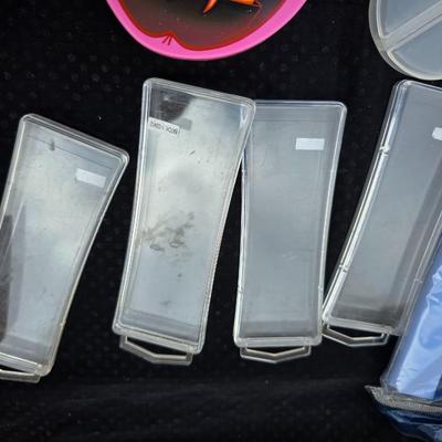 Grouping of bath soaps - scented - pill organizers - and a new shower curtain liner