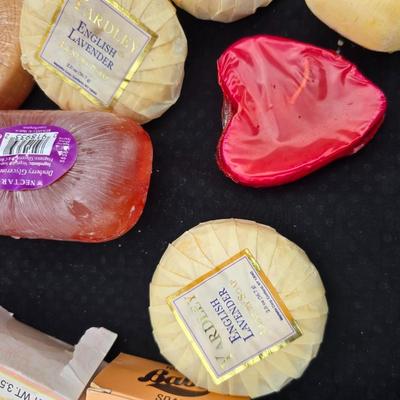 Grouping of bath soaps - scented - pill organizers - and a new shower curtain liner