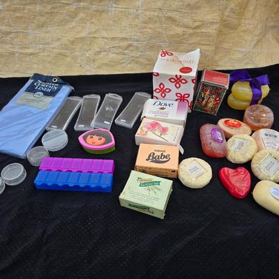 Grouping of bath soaps - scented - pill organizers - and a new shower curtain liner