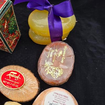 Grouping of bath soaps - scented - pill organizers - and a new shower curtain liner