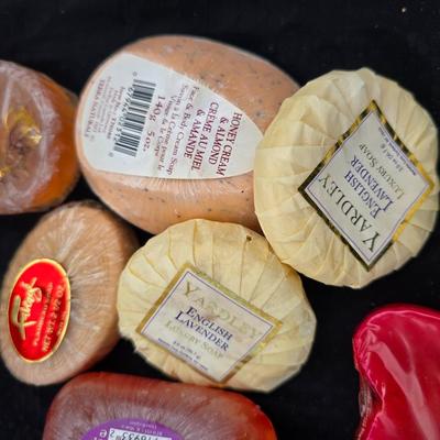 Grouping of bath soaps - scented - pill organizers - and a new shower curtain liner