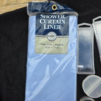 Grouping of bath soaps - scented - pill organizers - and a new shower curtain liner