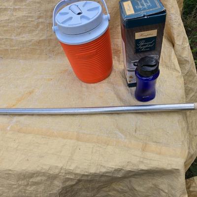 Two long, large fish nets - bob bet bait box- thermos, and a water bottle