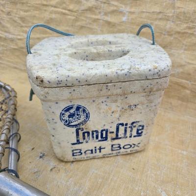 Two long, large fish nets - bob bet bait box- thermos, and a water bottle