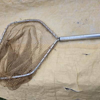 Two long, large fish nets - bob bet bait box- thermos, and a water bottle