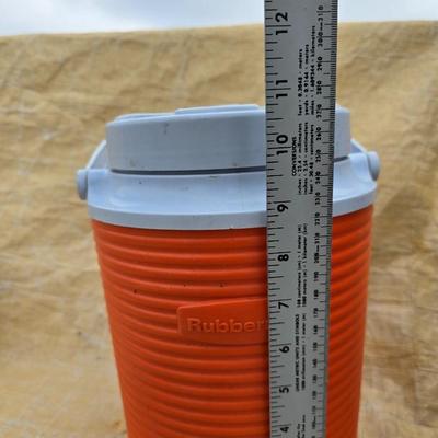 Two long, large fish nets - bob bet bait box- thermos, and a water bottle