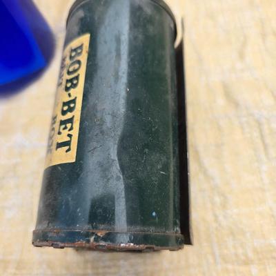 Two long, large fish nets - bob bet bait box- thermos, and a water bottle