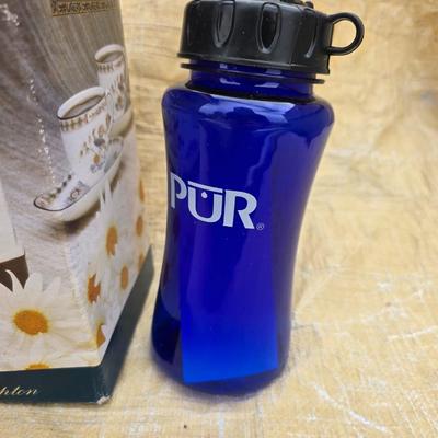 Two long, large fish nets - bob bet bait box- thermos, and a water bottle