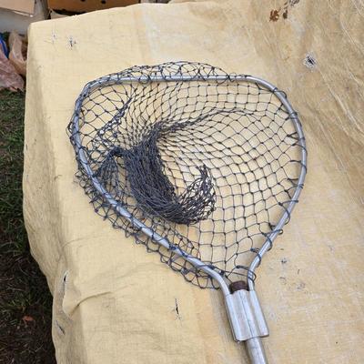 Two long, large fish nets - bob bet bait box- thermos, and a water bottle
