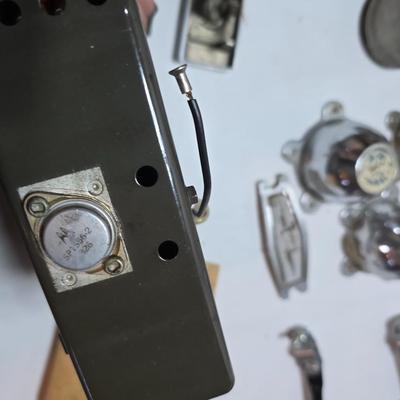 Lots of vintage car parts - trim - shifters - radio - and more