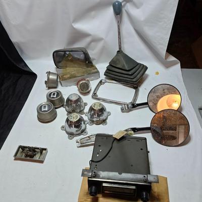 Lots of vintage car parts - trim - shifters - radio - and more