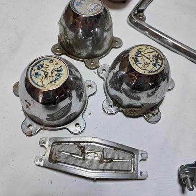 Lots of vintage car parts - trim - shifters - radio - and more