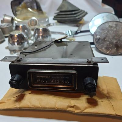 Lots of vintage car parts - trim - shifters - radio - and more