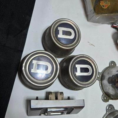 Lots of vintage car parts - trim - shifters - radio - and more
