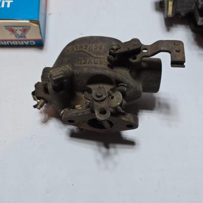 Antique Wisconsin gas carburetor - larger carburetor - and many carburetor tune up kits