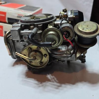 Antique Wisconsin gas carburetor - larger carburetor - and many carburetor tune up kits