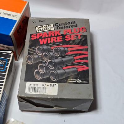 Large variety of auto parts in packaging - Datsun - Ford and more