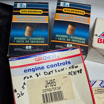 Large variety of auto parts in packaging - Datsun - Ford and more