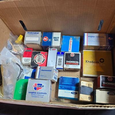 Large variety of auto parts in packaging - Datsun - Ford and more