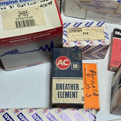 Large variety of auto parts in packaging - Datsun - Ford and more