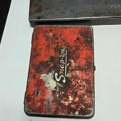 Vintage Plomb tools catalog with military jeep cologn bottle and two vintage snap on metal organizing boxes -
