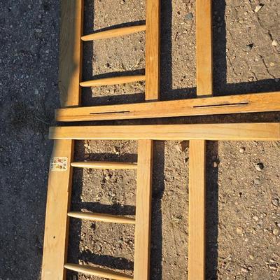 Two matching twin - sized wooden headboard & footboards