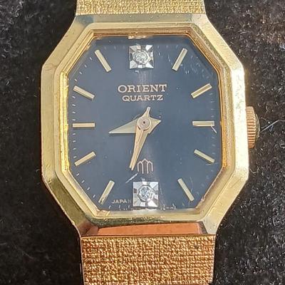 Two womens watches with faux diamonds and a Big huge faux diamond ring