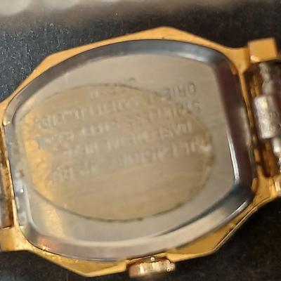 Two womens watches with faux diamonds and a Big huge faux diamond ring