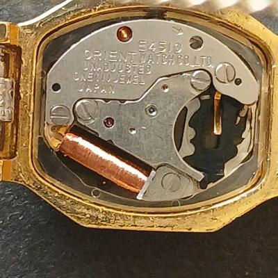 Two womens watches with faux diamonds and a Big huge faux diamond ring