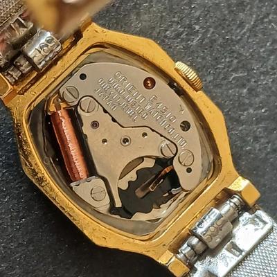 Two womens watches with faux diamonds and a Big huge faux diamond ring
