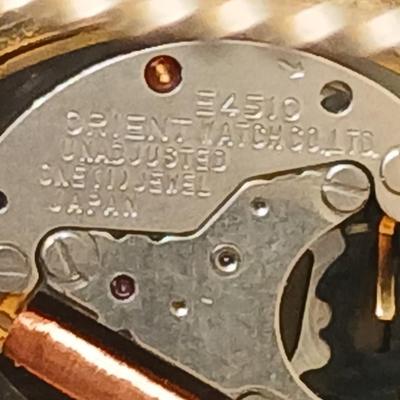Two womens watches with faux diamonds and a Big huge faux diamond ring