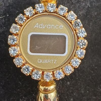 Two womens watches with faux diamonds and a Big huge faux diamond ring