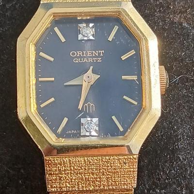 Two womens watches with faux diamonds and a Big huge faux diamond ring