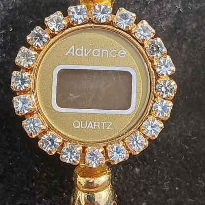Two womens watches with faux diamonds and a Big huge faux diamond ring