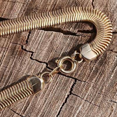 Two gold toned thick chain necklaces with a Watch - it watch