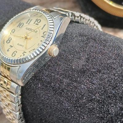 Two gold toned thick chain necklaces with a Watch - it watch