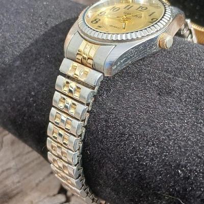 Two gold toned thick chain necklaces with a Watch - it watch