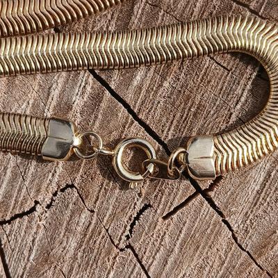 Two gold toned thick chain necklaces with a Watch - it watch