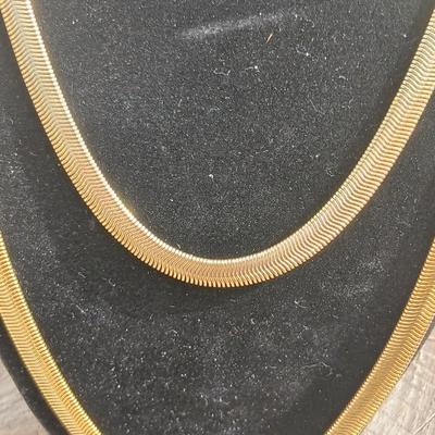 Two gold toned thick chain necklaces with a Watch - it watch