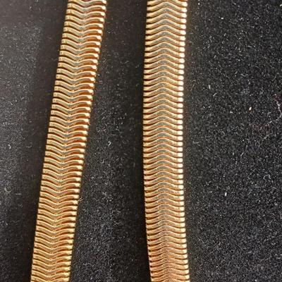 Two gold toned thick chain necklaces with a Watch - it watch