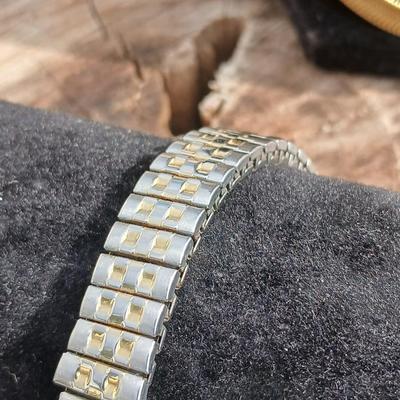 Two gold toned thick chain necklaces with a Watch - it watch
