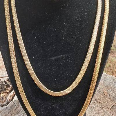 Two gold toned thick chain necklaces with a Watch - it watch