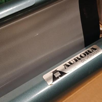 Vintage Aurora projection screen with an electric black light