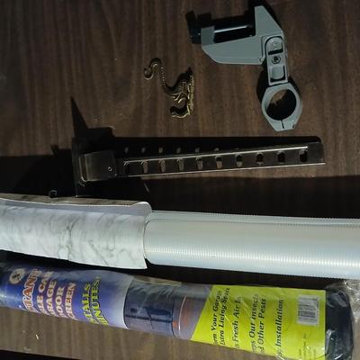 Giant garage door screen new in the package - some shelf liner - a small vise and more