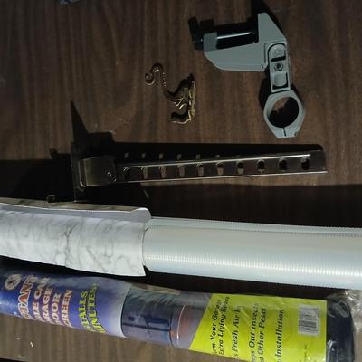 Giant garage door screen new in the package - some shelf liner - a small vise and more