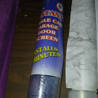 Giant garage door screen new in the package - some shelf liner - a small vise and more