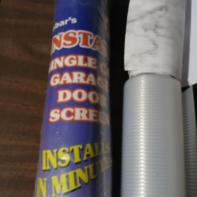 Giant garage door screen new in the package - some shelf liner - a small vise and more