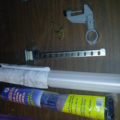 Giant garage door screen new in the package - some shelf liner - a small vise and more