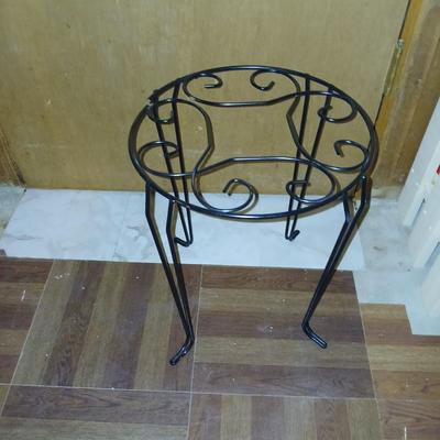 Three tiered adjustable plant stand with a larger plant stand